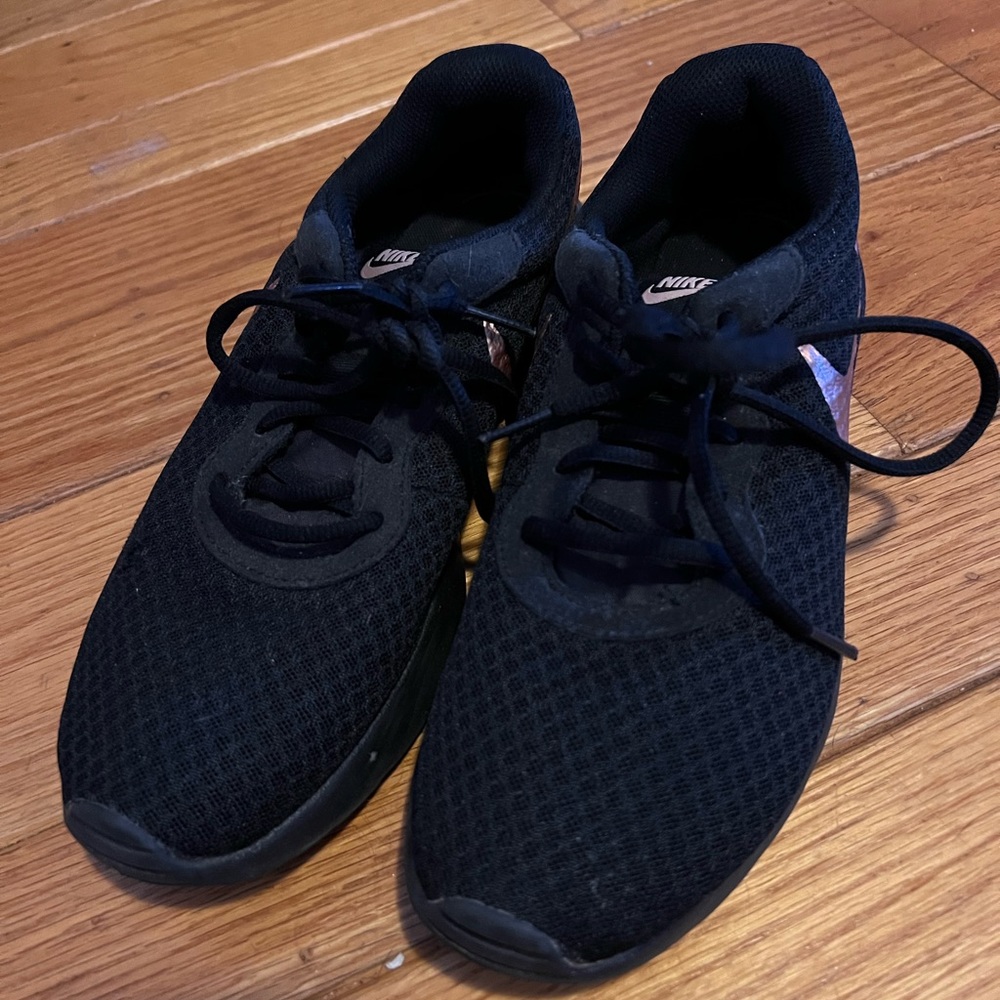 Black and rose gold Nike tennis shoes